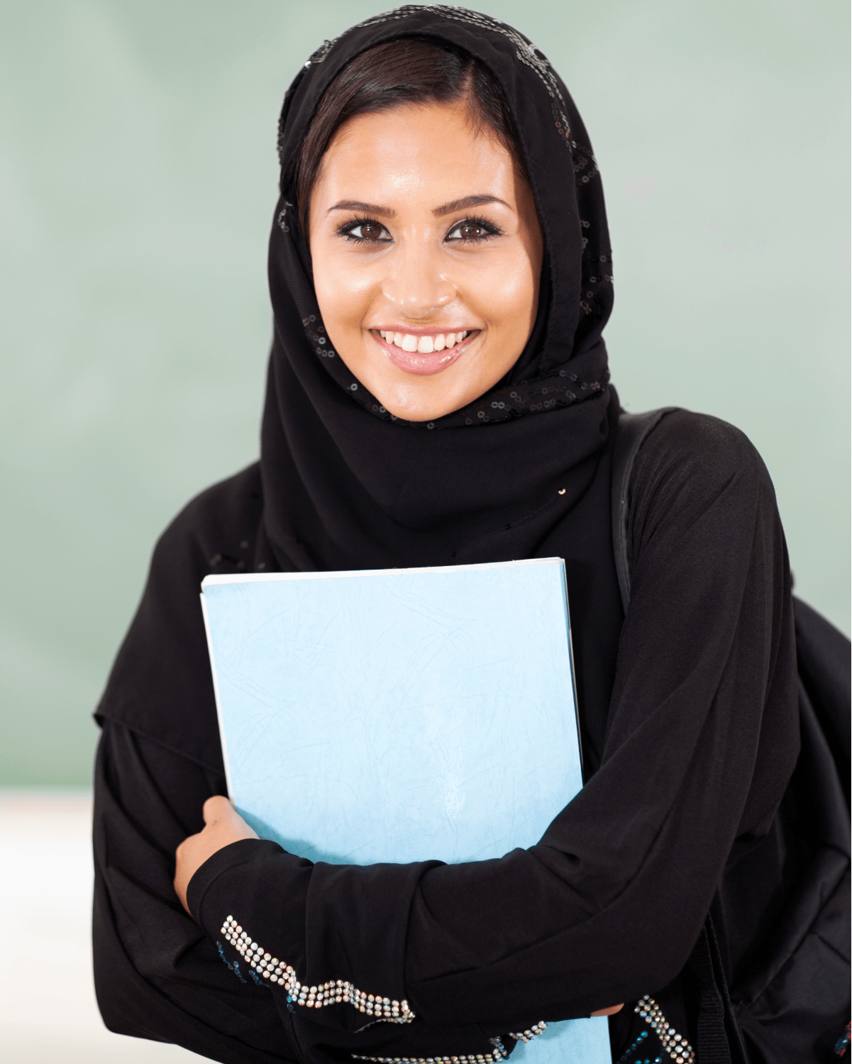 A female student clutching her notebook.